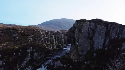 A drone shot over a wild river gorge, lochs and mountains Stock Footage 171222818