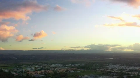 Drone shot panning down on a tropical landscape during sunset Stock Footage 124372544