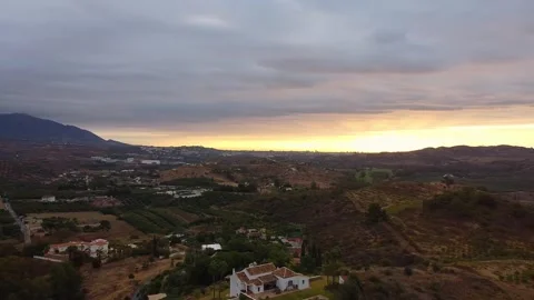 Drone shot panning left to right over a green landscape in Mijas, Málaga Stock Footage 304906316