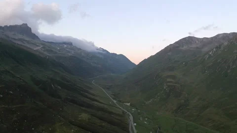 Drone shot panning over cloudy mountains in Switzerland. 動画素材 143464051