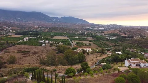 Drone shot panning right to left over a green landscape in Mijas, Málaga, Stock Footage 304972207