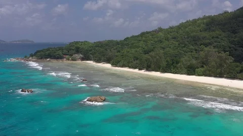 Drone shot: Panoramic view of Anse Severe beach on La Digue island, Seychelles 動画素材 105354247