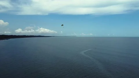 Drone shot of parasailing over the ocean sea beach Stock Footage 231898708