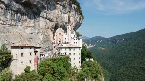 Drone shot of people exploring Santuario de la Madonna della Corona in Italy Stock Footage 163452353
