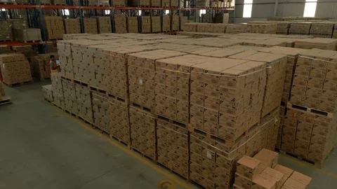 Drone Shot of people working inside a big warehouse Stock Footage 220474702