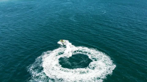Drone Shot of a Personal Water Craft Moving at the Sea Ocean Resort Vacation Stock-Footage 117097853