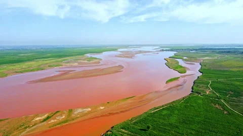 Drone shot of plain rivers - green fields - rice wetlands Stock Footage 257905542