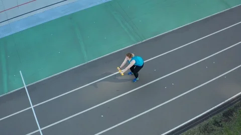 Drone shot of plus size female exercising outdoors Video stock 112633894