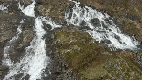 Drone Shot Pulling Away from a Large Waterfall In Lofoten Stock Footage 116358818