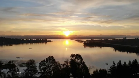 Drone shot pulling away from a sunset Video stock 102131926