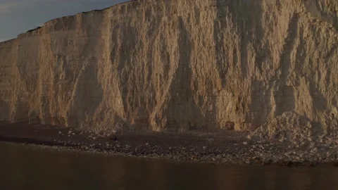 Drone shot pulling back from beautiful cliffs sunset Stock Footage 132818006