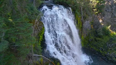 Drone shot pulls back revealing waterfall Stock Footage 318481431