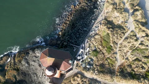 Drone shot pullsback revealing lighthouse along the Coquille river Stock Footage 251756168