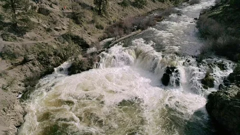 Drone shot of raging spring waterfall, 4K Stock Footage 123318840