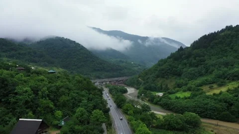 Drone shot, rain, mountain, cloud, highway. Stock Footage 197458155