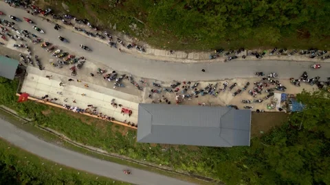 Drone shot of a raodstop during the Ha Giang Loop in Vietnam Stock Footage 313798255