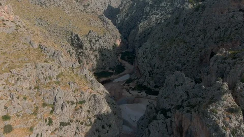 Drone shot red beautiful beach in the middle of a rocky gorge Stock Footage 119443024