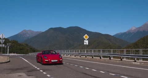 Drone Shot Red Convertible Driving Coastal Route Stock Footage 160149887