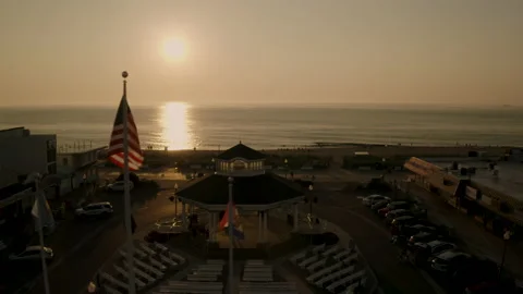 Drone shot of the Rehoboth Beach Boardwalk at sunrise 库存影片 208903053