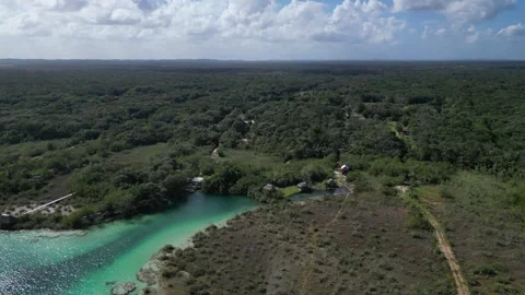 Drone Shot of a Remote Coastline With Forested Hills and Open Water bacalar Vídeos de archivo 322547535