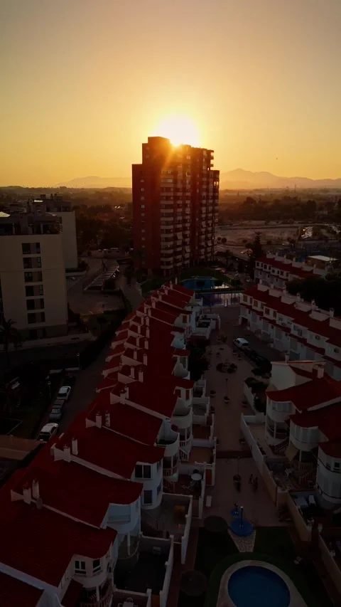 Drone shot of residential complex and sunset skyline Stock Footage 311065092
