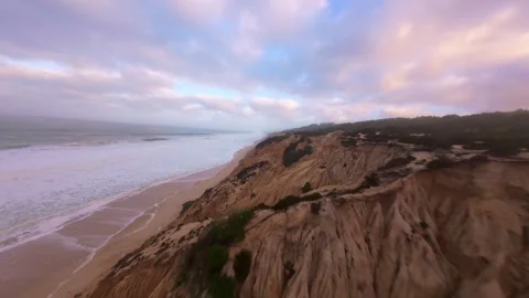 Drone shot reveals dramatic coastal cliffs during dawn After the storm Stock Footage 345055429