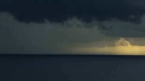 The drone shot reveals a dramatic storm over the ocean. Stock Footage 307775097