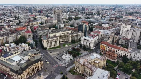 Drone shot of Revolution Square and cityscape in Bucharest city, Romania Video stock 347452553