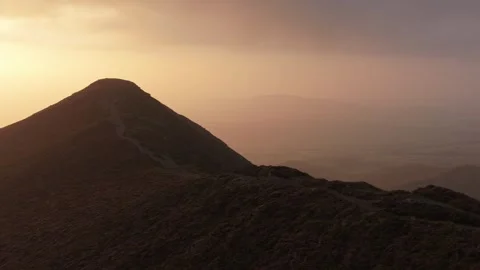 Drone shot of a ridge path in the Lake District UK Sunset Stock Footage 314193630