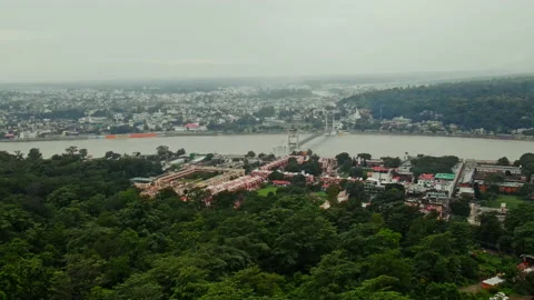 Drone shot of Rishikesh City during monsoon, Aerial View of Holy River Ganga Stock Footage 161113576