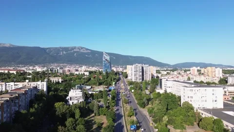 Drone shot, rising above Sofia, the capital city of Bulgaria on a bright summer Stock Footage 294180861