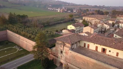 Drone Shot Rising Over Warm Italian Village with Red-Tiled Roofs Stock Footage 304843828