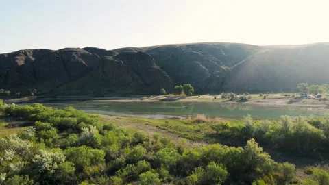 Drone shot of river and mountains at sunset in Kazakhstan Stock Footage 193934005