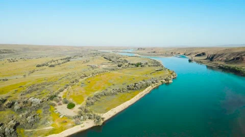 Drone shot of river and mountains at sunset in Kazakhstan Stock Footage 194469746