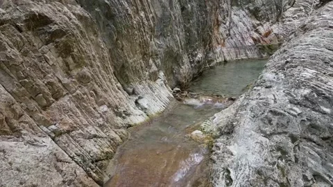 Drone Shot of River and Small Waterfall  Salto de Baboor, Dominican Republic Stock Footage 307975207