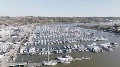Drone shot of a river covered in moored boats Stock Footage 307610804