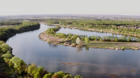 Drone shot of a river flowing through green environment. Stock Footage 149112622