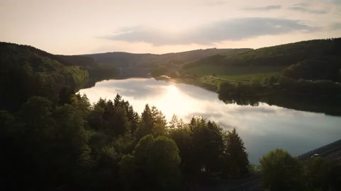 Drone shot of a river in Germany with the sun reflecting from the water Stock Footage 132697661