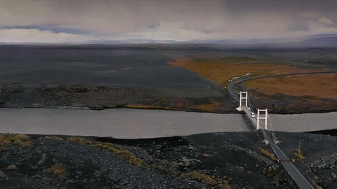 Drone shot of a river in the Icelandic lava landscape and dark cloudscape. Stock Footage 116207967