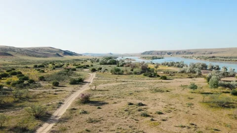 Drone shot of river Ili and spring steppe in Kazakhstan Stock Footage 193671949