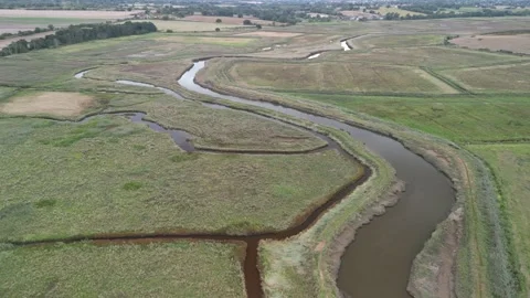 Drone shot of river meandering through a marsh Stock Footage 211744691