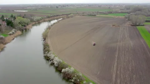 Drone Shot of River Meandering Through Fields Stock Footage 253772625