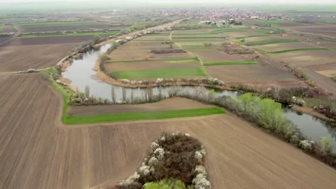 Drone Shot of River Meandering Through Fields Stock Footage 253773039