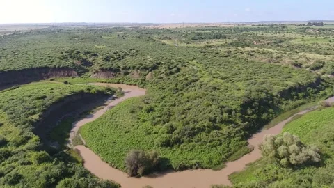 Drone shot of a river surrounded by beautiful mountains stock video Stock Footage 214359027