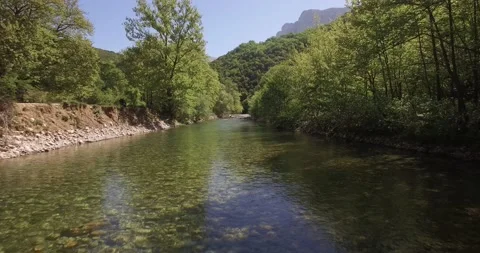 A drone shot from the river Voidomatis, at Zagori Greece Video stock 220744586
