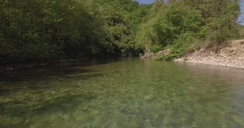 A drone shot from the river Voidomatis, at Zagori Greece Video stock 220744599