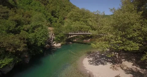 A drone shot from the river Voidomatis, at Zagori Greece Video stock 220745284