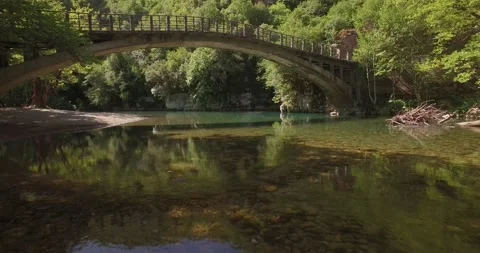 A drone shot from the river Voidomatis, at Zagori Greece Video stock 220745342