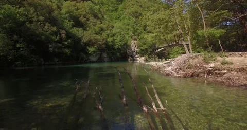 A drone shot from the river Voidomatis, at Zagori Greece Video stock 220745347