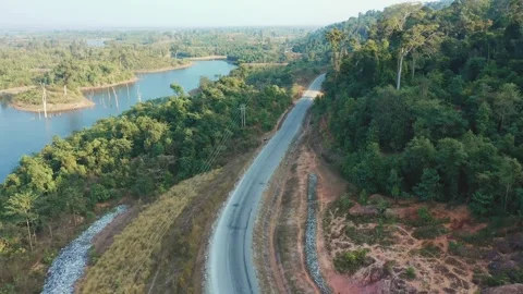 Drone shot of road along the river in Thalang, Laos Stock Footage 247866448